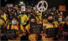  ?? Photograph: Daniel Kim/ZUMA Wire/REX/Shuttersto­ck ?? Black Lives Matters protesters march in downtown Portland on Saturday night.