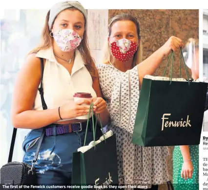  ??  ?? The first of the Fenwick customers receive goodie bags as they open their doors