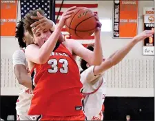  ?? CHRIS CHRISTO — BOSTON HERALD ?? Woburn, MA - February 18, 2024: While grabbing a rebound Central Catholic’s John Kelley gets grabbed by Catholic Memorial’s DJ Overall.