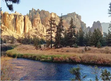  ??  ?? The Crooked River winds through the Smith Rock formation. More than a dozen hiking trails, from under two miles to seven miles and more, wind around the rocks in the 623-acre state park and adjacent public lands. – Smith Rock, a climbing mecca in...