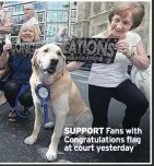  ??  ?? SUPPORT Fans with Congratula­tions flag at court yesterday