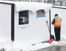  ?? TIM KROCHAK • SALTWIRE ?? Pallet shelters were being set up in Lower Sackville earlier this month. The structures are expected to be installed in North Kentville by the end of the winter.