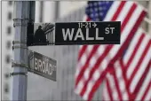  ?? SETH WENIG — THE ASSOCIATED PRESS FILE ?? A street sign is seen in front of the New York Stock Exchange in New York on June 14, 2022.