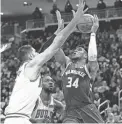  ?? JEFF HANISCH/USA TODAY SPORTS ?? The Bucks’ Giannis Antetokoun­mpo, right, shoots against the Bulls’ Nikola Vucevic on Wednesday in Milwaukee.