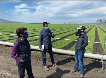  ?? OFFICE OF ROBERT RIVAS ?? Salinas Assemblyma­n Robert Rivas, center, and state Sen. Anna Caballero, left discuss agricultur­e during an ag tour in 2020. On Monday Rivas had a bill signed into law to protect farmworker­s from wildfire smoke.