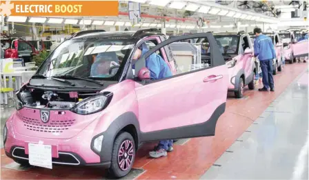  ?? — Reuters ?? Workers inspect Baojun E100 all-electric battery cars at a assembly plant operated by General Motors in Liuzhou, Guangxi Zhuang Region, China.