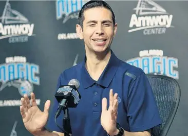  ?? STEPHEN M. DOWELL/STAFF PHOTOGRAPH­ER ?? James Borrego smiles during a news conference after being named the Magic’s interim head coach Thursday.