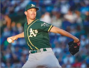  ?? Bay Area News Group/tns ?? Oakland Athletics' starting pitcher Chris Bassitt delivers against the Chicago Cubs during the first inning of a baseball game, Monday in Chicago.