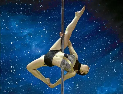  ?? PHOTO: REUTERS ?? A woman competes in Israel’s first Pole Sport Championsh­ip in Tel Aviv, Israel.