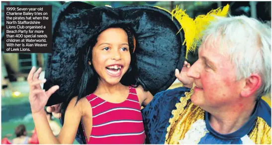  ??  ?? 1999: Seven-year-old Charlene Bailey tries on the pirates hat when the North Staffordsh­ire Lions Club organised a Beach Party for more than 400 special needs children at Waterworld. With her is Alan Weaver of Leek Lions.