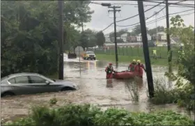  ?? SUBMITTED PHOTO ?? Because the ground had been so saturated over the summer, rain led to frequent flooding in the region. Emergency crews responded to this water rescue in Chester County in late September.
