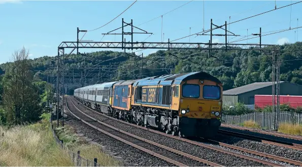  ?? James Stearn ?? On July 29, 66722 Sir Edward Watkin had the dubious honour of hauling 442420 and 442415 on their final journey from Bournemout­h Depot to Wolverton Works for stripping, with 73107 Tracy and 73128 O.V.S. Bullied CBE acting as translator vehicles. The units were the final ones to depart from Bournemout­h when they started their journey the previous night, 442420 having made several trips back and forth over recent weeks, acting as a brake force runner for the AC traction converted units. The formation is seen at Old Linslade on the West Coast Main Line.