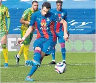  ??  ?? Crystal Palace skipper Luka Milivojevi­c converts the penalty winner