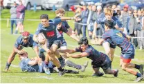  ?? PHOTO / FILE ?? Tauranga Boys’ College and Rotorua Boys’ High School go head-to-head during this year’s Super 8 Rugby competitio­n.