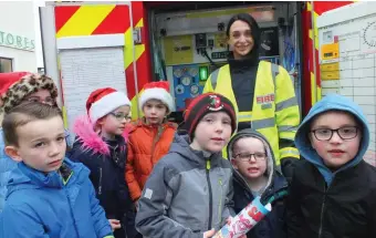  ??  ?? Donna Murphy of Mallow Fire Service pictured with local children at Market Square on Saturday afternoon.