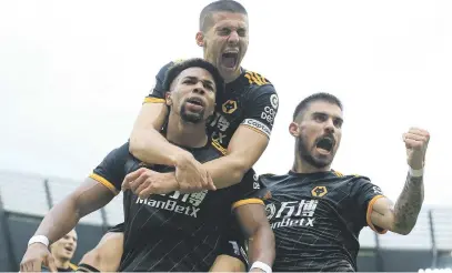  ?? Picture: AFP ?? ON THE PROWL. Wolverhamp­ton Wanderers’ Adama Traore (left) celebrates scoring the opening goal against Manchester City at the Etihad Stadium yesterday. Wolves won 2-0.