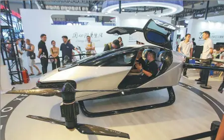  ?? ZHAO JUNCHAO / FOR CHINA DAILY ?? The X2, a flying car developed by Xpeng Aeroht affiliated with automaker Xpeng, is displayed at the 2023 Smart China Expo in Chongqing in September. Flying cars are predicted to become a major factor in the low-altitude economy in the near future.