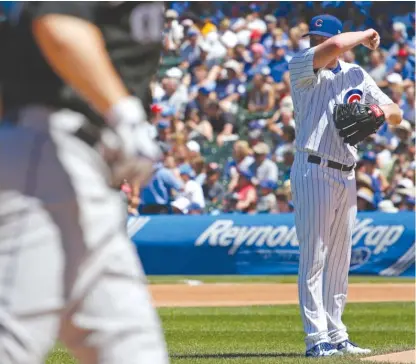  ??  ?? Eddie Butler gathers his composure after serving up a home run to the Rockies’ Mark Reynolds in the fourth inning Saturday. | AP