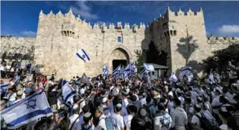  ?? AFP/VNA Photo ?? Tens of thousands of Israeli nationalis­ts marched to Jerusalem’s Old City on Thursday in an annual flag-waving march commemorat­ing Israel’s capture of it.