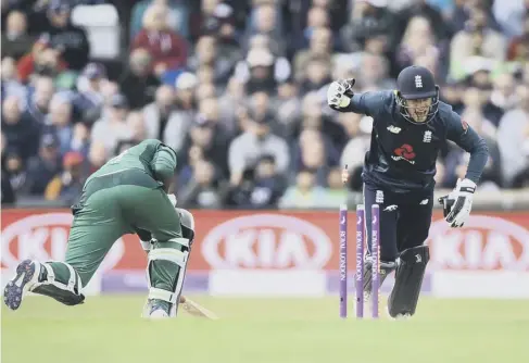  ??  ?? 0 Jos Buttler celebrates stumping Pakistan’s Sarfaraz Ahmed just three runs from making his century, the visitors’ best figure on the day.