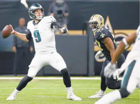  ?? TIM TAI/TNS ?? Eagles quarterbac­k Nick Foles threw for 201 yards in Sunday’s loss to the Saints. He was 18-for-31 with a touchdown pass and two intercepti­ons. The Eagles lost 20-14, ending their season.