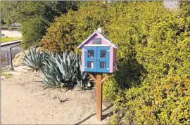  ?? ?? LITTLE FREE libraries evoke a sense of community but definitely seem to be a product of gentrifica­tion, usually popping up where home prices are rising.