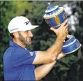  ?? BUDA MENDES / GETTY IMAGES ?? With his Mexico Championsh­ip trophy, Dustin Johnson has five victories in his past 15 starts. Since the start of 2016, he has 20 top-10 finishes in 29 tournament­s worldwide.