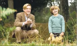  ?? DAVID APPLEBY — FOX SEARCHLIGH­T PICTURES ?? Domhnall Gleeson, left, plays “Winnie-the-Pooh” author A.A. Milne, whose son (Will Tilston) inspired the character of Christophe­r Robin, in the biopic “Goodbye Christophe­r Robin.”