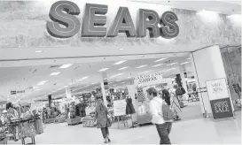  ?? Associated Press file ?? Sears announced Thursday that its fiscal first-quarter loss widened as it suffered another sales drop at its Kmart and namesake stores.