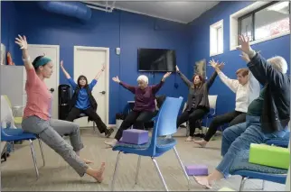  ?? ALAN DEP — MARIN INDEPENDEN­T JOURNAL, FILE ?? Yoga instructor Stacie Dooreck leads a chair yoga class at the Intergener­ational Center in Corte Madera.