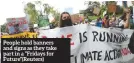  ?? ?? People hold banners and signs as they take part in a “Fridays for Future”(reuters)