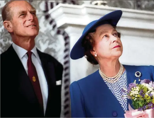  ?? — Photos: REUTERS ?? Stand by me: The Duke of Edinburgh, Prince Philip, is almost always by Queen Elizabeth’s side. Here the royal couple were photograph­ed at Maritime Museum in London, in 1990.