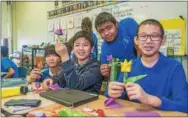  ??  ?? Students at the Kirkbride School in Philadelph­ia create a horticultu­ral craft project for the Junior Flower Show.