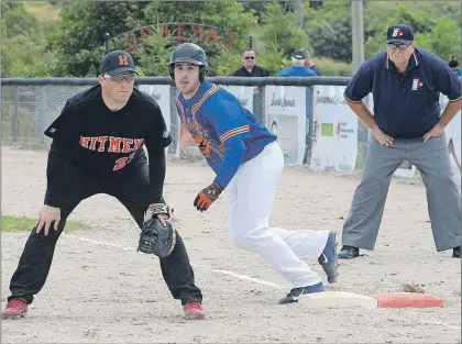  ?? JOE GIBBONS/THE TELEGRAM ?? Bridge City Sharks second baseman Brandon Dauvin steps off the base and Galway Hitmen first-baseman Joey Maynard follows the play as a pitch makes its way to the plate during the opening game of the 2016 Canadian Senior Men’s softball championsh­ip at...