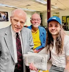  ?? Paul Grondahl/special to the Times Union ?? Filmmaker Miles Joris-peyrafitte, far right, with his father, poet and retired Ualbany professor Pierre Joris, center, and novelist William Kennedy, who had cameos during filming in the newsroom of the Times Union in June 2022.