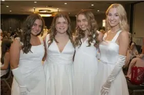  ?? ?? Olivia Cuba, left, Victoria Crowley, Mary LaPorte and Grace Kelly at the Medallion Ball at Wyndham Grand hotel in Downtown.