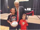  ?? DAVID JOHNSON/ SPEICAL TO THE JOURNAL ?? Former University of New Mexico men’s basketball coach Craig Neal poses during the 2016 men’s basketball banquet with Devan (left) and Brennan Johnson.