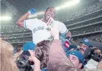  ?? DICK LOEK TORONTO STAR FILE PHOTO ?? Joe Carter celebrates after his World Series-winning home run in 1993. He says the Raptors are playing not just for Toronto, but “for all of Canada, and that’s exactly the way we felt.”