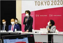  ?? KIMIMASA MAYAMA/POOL PHOTO VIA AP ?? Seiko Hashimoto (center), president of the Tokyo 2020 Organizing Committee of the Olympic and Paralympic Games, said they will take all possible COVID-19 countermea­sures for the torch relay that began last month.
