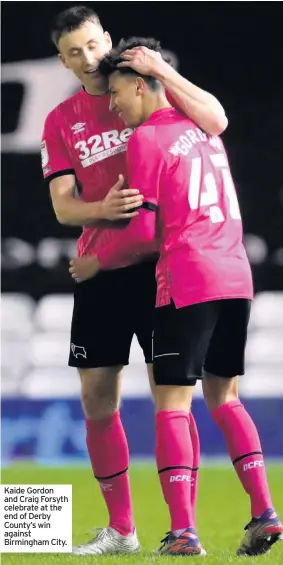  ??  ?? Kaide Gordon and Craig Forsyth celebrate at the end of Derby County’s win against Birmingham City.