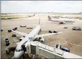  ??  ?? In this file photo, American Airlines planes are seen at Dallas-Fort Worth Internatio­nal Airport in Grapevine, Texas. American Airlines is threatenin­g to prohibit customers from making changes to nonrefunda­ble tickets if Congress makes good on a proposal to crack down on unreasonab­le airline fees. (AP)