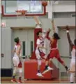  ?? PAUL DICICCO — THE NEWS-HERALD ?? Harvey’s Daylin Davis puts a floater over Perry’s Nate Cubbison.