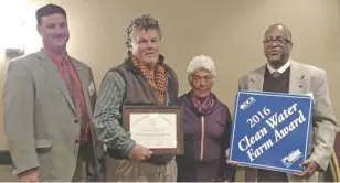  ??  ?? Presenting the Bay-Friendly Farm Award to Flint Hill's Mike Sands (second from left) are, from left, CSWCD board chair Lynn Graves, Rappahanno­ck director Monira Rifaat and Darryl Glover, director of the Department of Conservati­on and Recreation Soil...