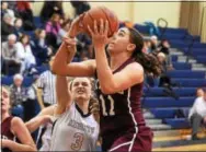  ?? PETE BANNAN — DIGITAL FIRST MEDIA ?? Oxford’s Grace Hennessey shots as Rustin’s Morgan Polidore defends. Hennessey scored 18 points in the Hornets’ victory.