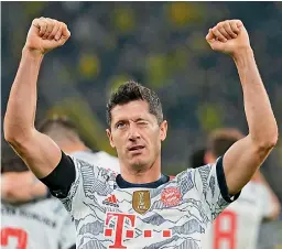  ?? — AP ?? Robert Lewandowsk­i of Bayern Munich celebrates after scoring his side’s third goal during the German Super Cup match against Borussia Dortmund in Dortmund, Germany, on Tuesday. Bayern won 3-1.