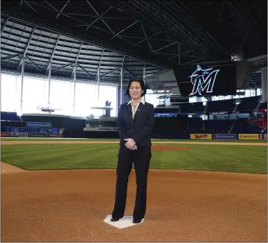  ?? JOSEPH GUZY — THE ASSOCIATED PRESS ?? In this photo provided by the Marlins, new general manager Kim Ng poses for a photo at Marlins Park before being introduced during a virtual news conference Nov. 16 in Miami.