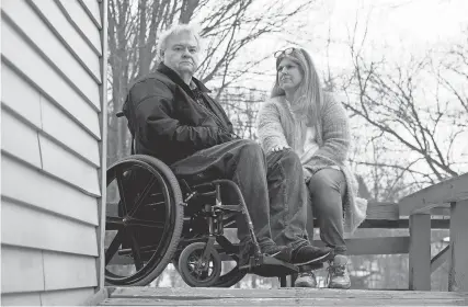  ??  ?? David and Jodi Schumaker sit outside a day after driving a 14-hour round trip from their home in Independen­ce Township, Mich., to Laurel, Miss., to find a COVID-19 vaccine for David, only to come home without one. ERIC SEALS/USA TODAY NETWORK