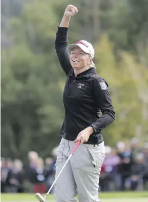  ?? LEAH HENNEL ?? Alena Sharp celebrates her putt on the 18th hole that shot her to sole possession of fourth place in the LPGA Canadian Open Sunday.