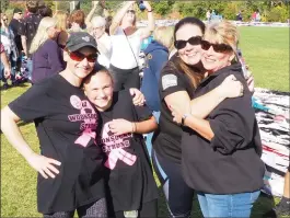  ?? Photo by Joseph B. Nadeau ?? Tammy Lomberto Roy, left, her daughter Mia, Stacey Beane and Tina Roy worked on the record-seeking effort on Monday.