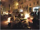  ?? DANIEL COLE/FOR THE ASSOCIATED PRESS ?? RIGHT: Garbage left on the streets by striking sanitation workers is set on fire by protesters after a demonstrat­ion Thursday near Concorde square, in Paris.